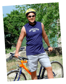 Jeffrey on a mountain bike, grinning